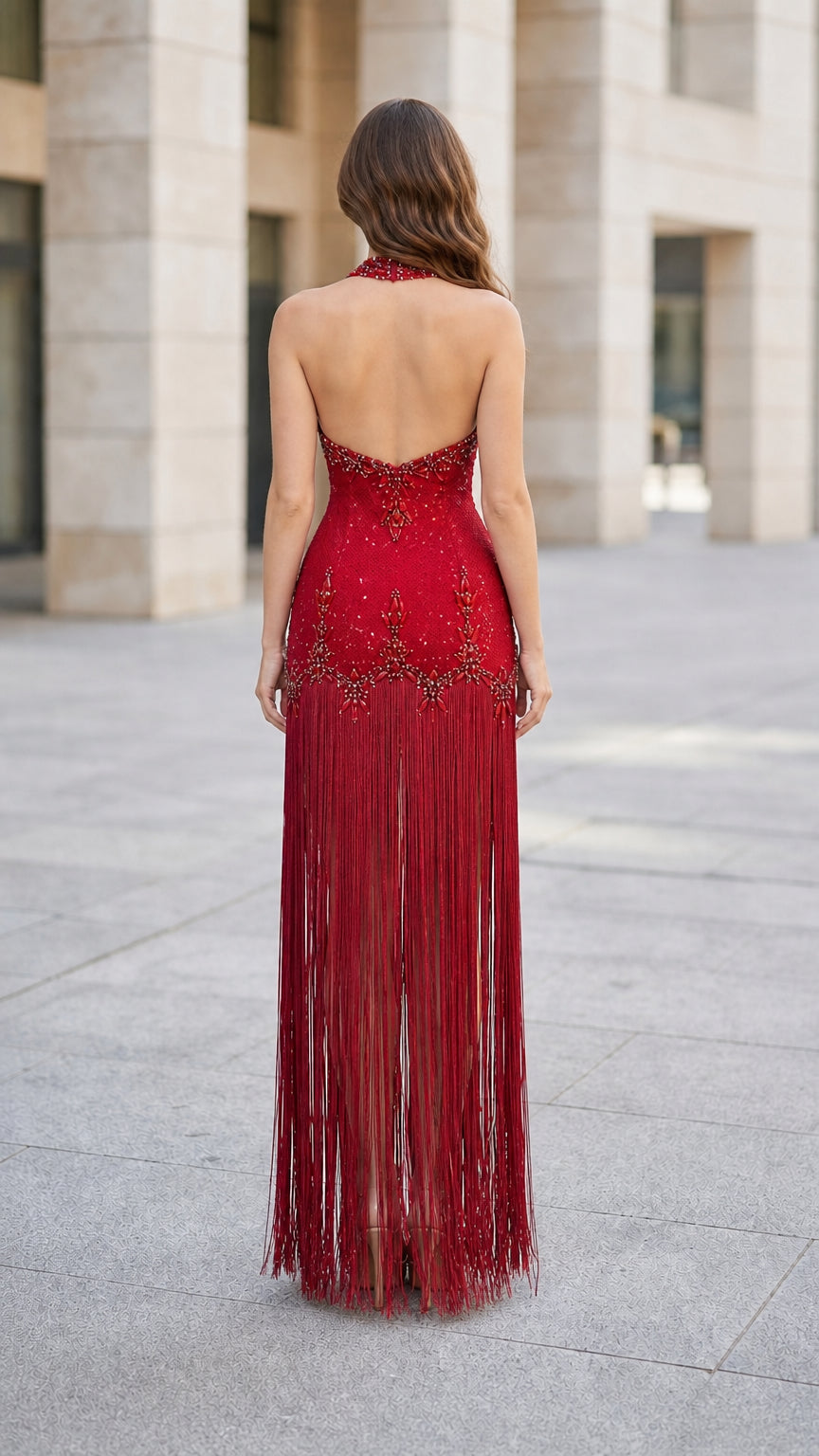 Back view showcasing halter neck and open back of Red gown