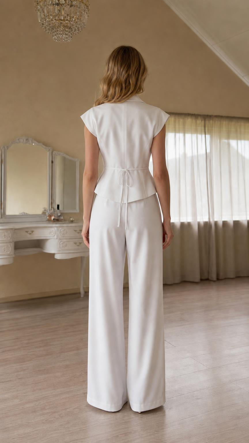 Back view showcasing back tie detail on white vest